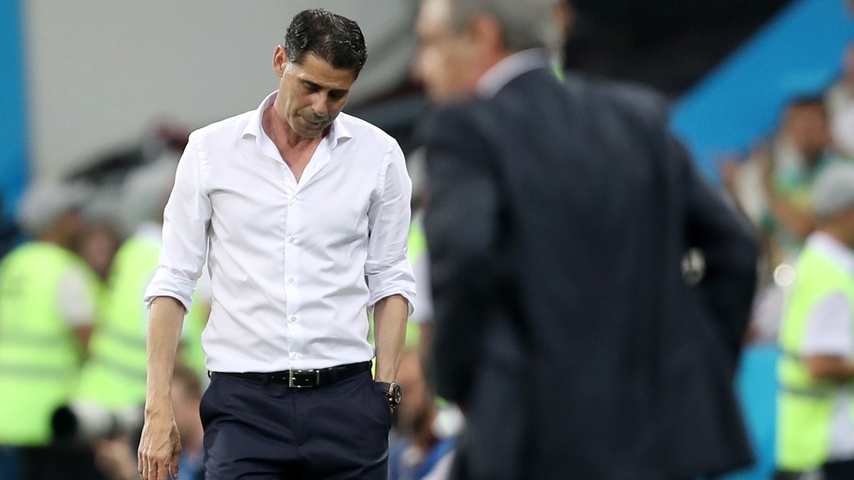 epa06811619 Spain's head coach Fernando Hierro (L) and Portugal's Fernando Santos (R) react after the FIFA World Cup 2018 group B preliminary round soccer match between Portugal and Spain in ...