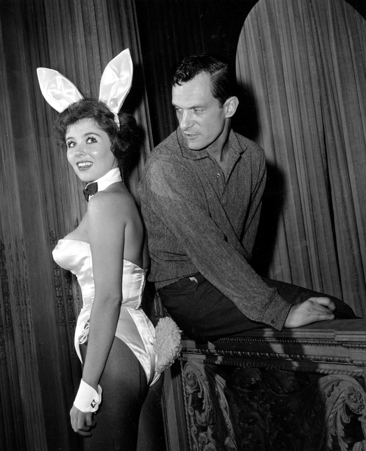 FILE - In this June 20, 1961 file photo, Playboy magazine publisher Hugh Hefner poses with "bunny-girl" hostess Bonnie J. Halpin at Hefner's nightclub in Chicago. Playboy founder and se ...