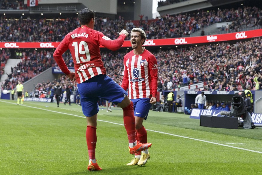MADRID, SPAIN - DECEMBER 10:Alvaro Morata of Atletico de Madrid and Antoine Griezmann of Atletico de Madrid celebrates a goal during the La Liga 2023/24 match between Atletico de Madrid and Almeria at ...