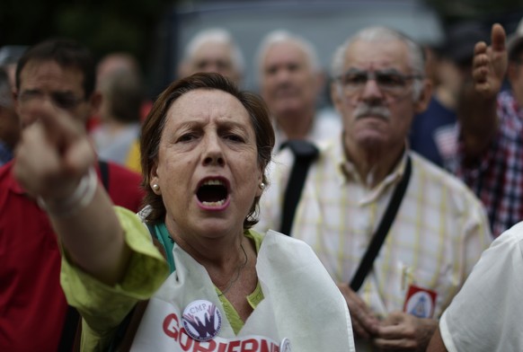 Pensioners protest in front of the Spanish Parliament in Madrid, Wednesday, Sept. 26, 2018. Retirees are calling for higher pensions and urging authorities to ensure funding for social security. (AP P ...