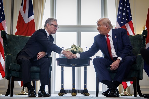 epa12269105 British Prime Minister Keir Starmer (L) and US President Donald J. Trump shake hands during their meeting at the Trump Turnberry golf resort in Turnberry, Scotland, Britain, 28 July 2025.  ...