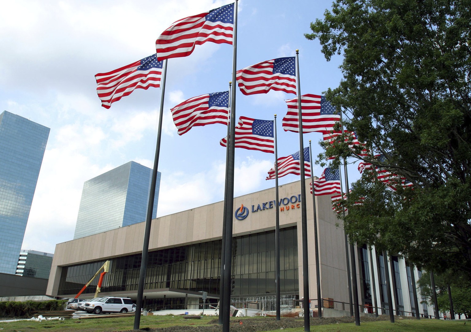 FILE - Flags fly in front of the Lakewood Church in Houston, June 28, 2005. Police in Texas said Sunday, Feb. 11, 2024, that they were responding to a possible shooting at the Houston megachurch run b ...