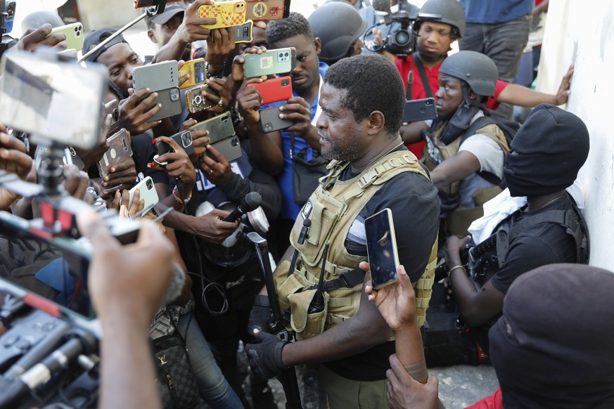 Jimmy Ch�rizier, a former elite police officer known as Barbecue who now runs a gang federation, holds a press conference in the Delmas 6 neighborhood of Port-au-Prince, Haiti, Tuesday, March 5, 2024. ...