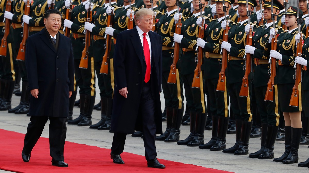 FILE - U.S. President Donald Trump, right, and Chinese President Xi Jinping inspect a honor guard during a welcome ceremony at the Great Hall of the People in Beijing, Nov. 9, 2017. (AP Photo/Andy Won ...