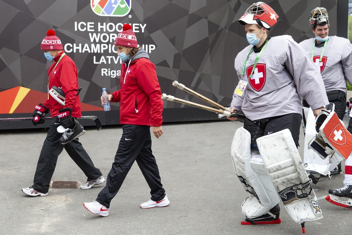 epa09215190 Tommy Albelin (L), assistant coach of Switzerland national ice hockey team, Patrick Fischer (2nd L), head coach of Switzerland national ice hockey team, Switzerland's goaltenders Leon ...