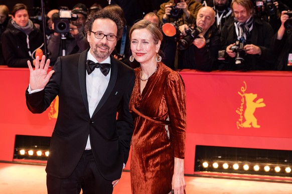epa08232149 Managing director of the Berlinale film festival Mariette Rissenbeek and Berlinale artistic director Carlo Chatrian arrive for the Opening Ceremony of the 70th annual Berlin International  ...