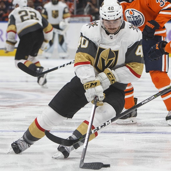 Vegas Golden Knights&#039; Ryan Carpenter (40) is chased by Edmonton Oilers&#039; Matthew Benning (83) during the third period of an NHL hockey game Sunday, Nov. 18, 2018, in Edmonton, Alberta. (Jason ...