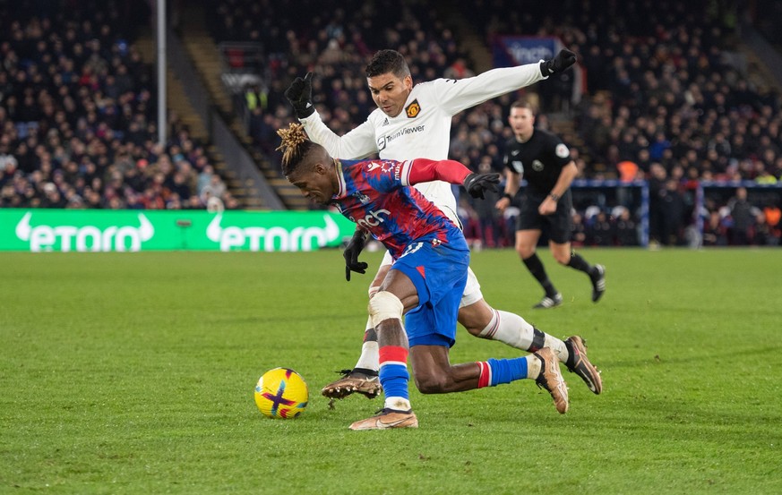 Wilfried Zaha of Crystal Palace and Casemiro of Manchester United, ManU during the Premier League match between Crystal Palace and Manchester United at Selhurst Park, London, England on 18 January 202 ...
