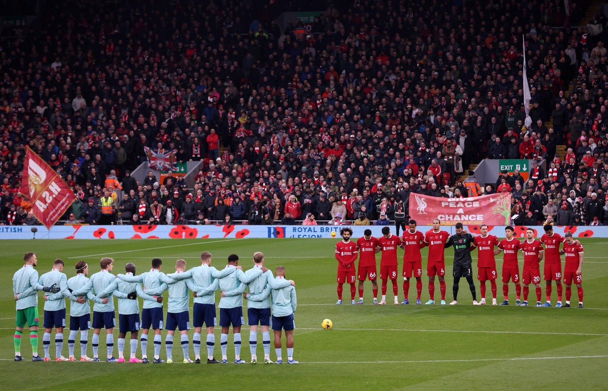 LIVERPOOL, ENGLAND - NOVEMBER 12: Liverpool and Brentford players and fans observe a minute of silence in honour of Armistice Day prior to the Premier League match between Liverpool FC and Brentford F ...