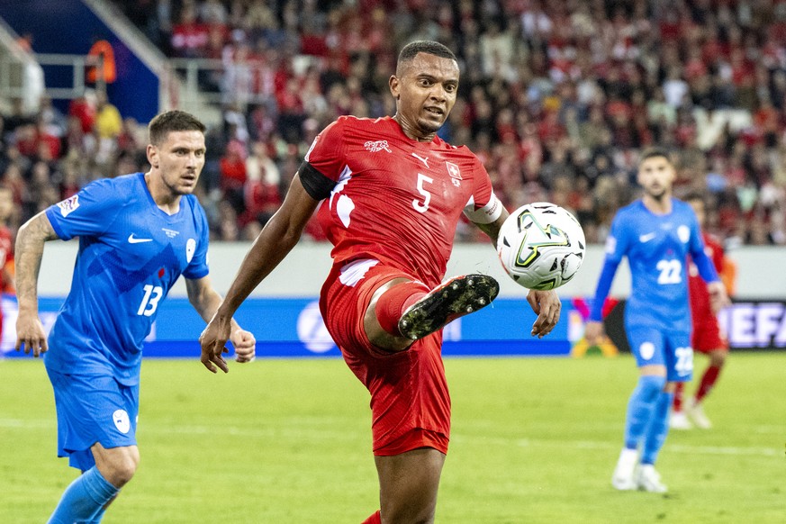 Manuel Akanji, centre, from Switzerland play against Erik Janza, left, from Slovenia during the UEFA Nations League, Leaegue B, Group 1 soccer match between Switzerland and Slovenia in the Thermoplana ...