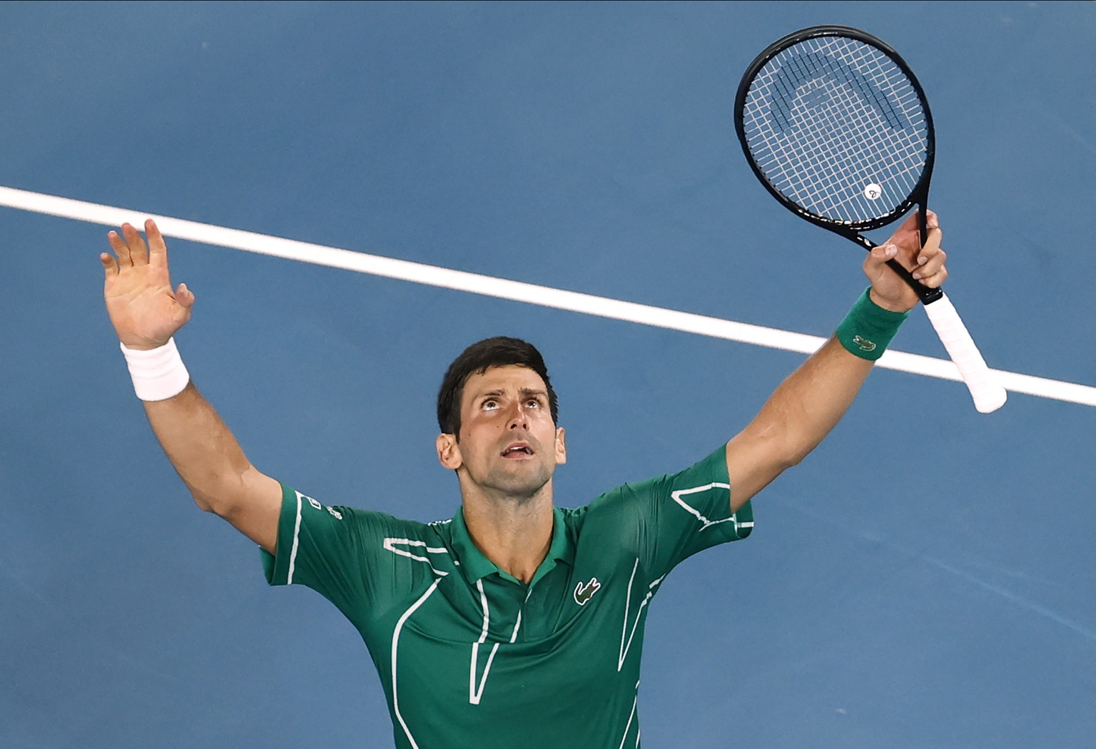 Serbia&#039;s Novak Djokovic celebrates after defeating Switzerland&#039;s Roger Federer in their semifinal match at the Australian Open tennis championship in Melbourne, Australia, Thursday, Jan. 30, ...