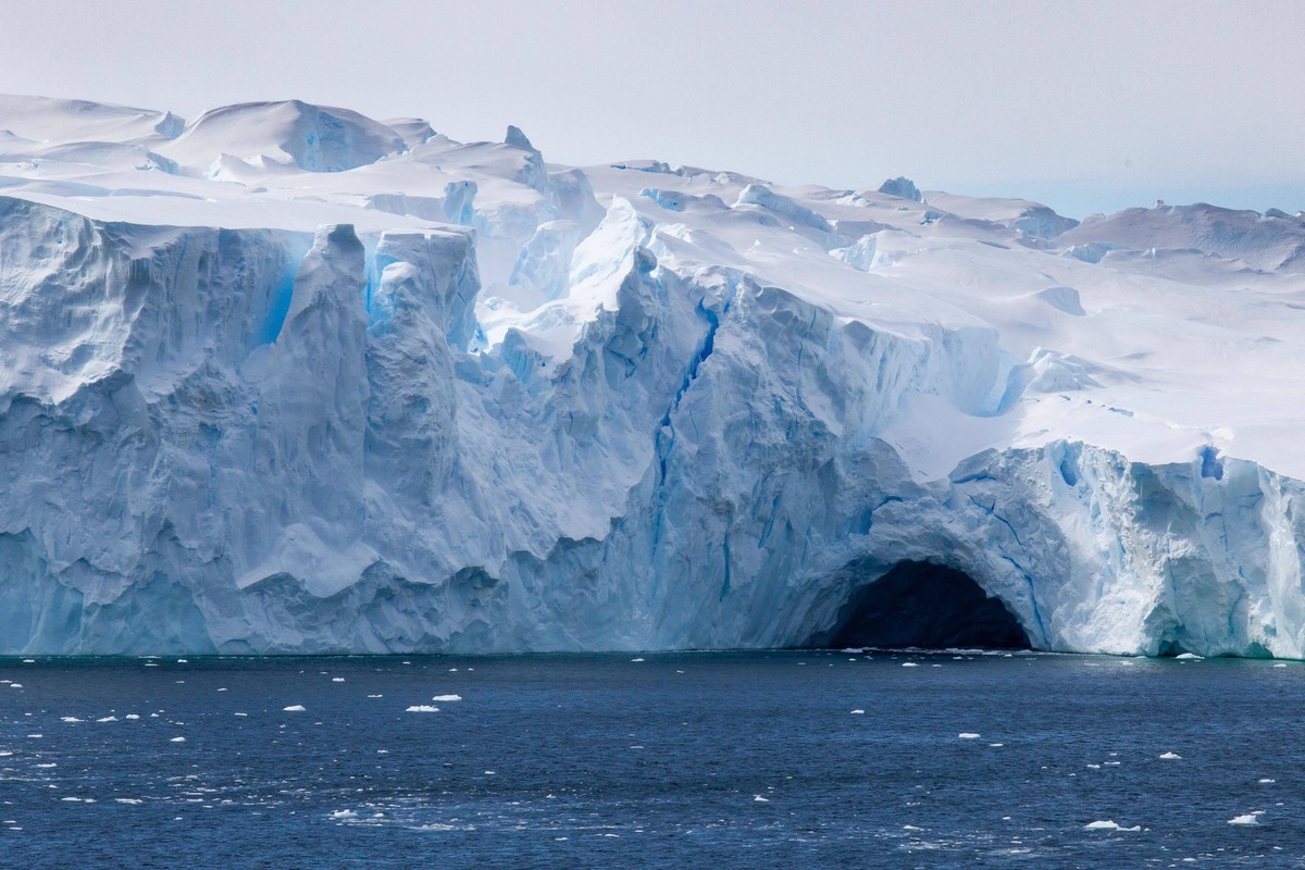 epa09699744 A handout photo made available by the Australian Antarctic Division (AAD) shows the Vanderford Glacier, Antarctica, 18 January 2022 (issued 21 January 2022). A deep canyon at the front of  ...