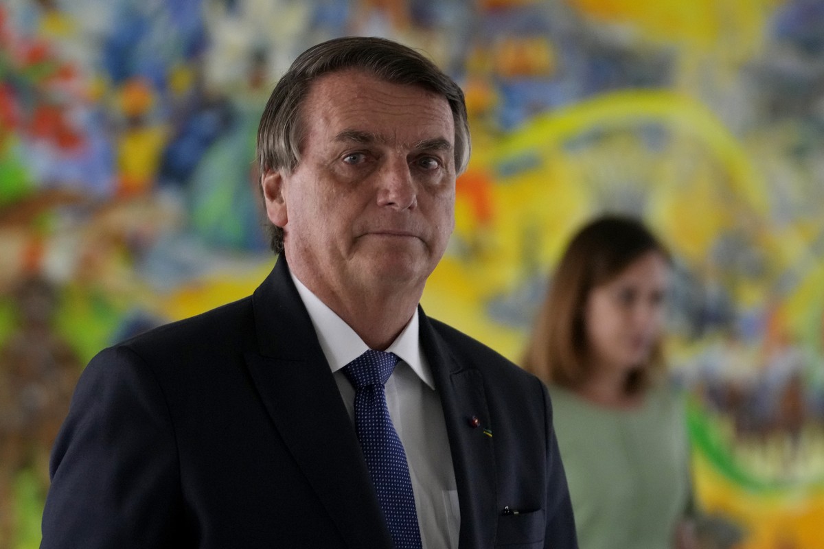 Brazil's President Jair Bolsonaro arrives ti attend a photographic exhibition on rare diseases, at the Planalto Presidential Palace, in Brasilia, Brazil, Thursday, July 7, 2022. (AP Photo/Eraldo  ...