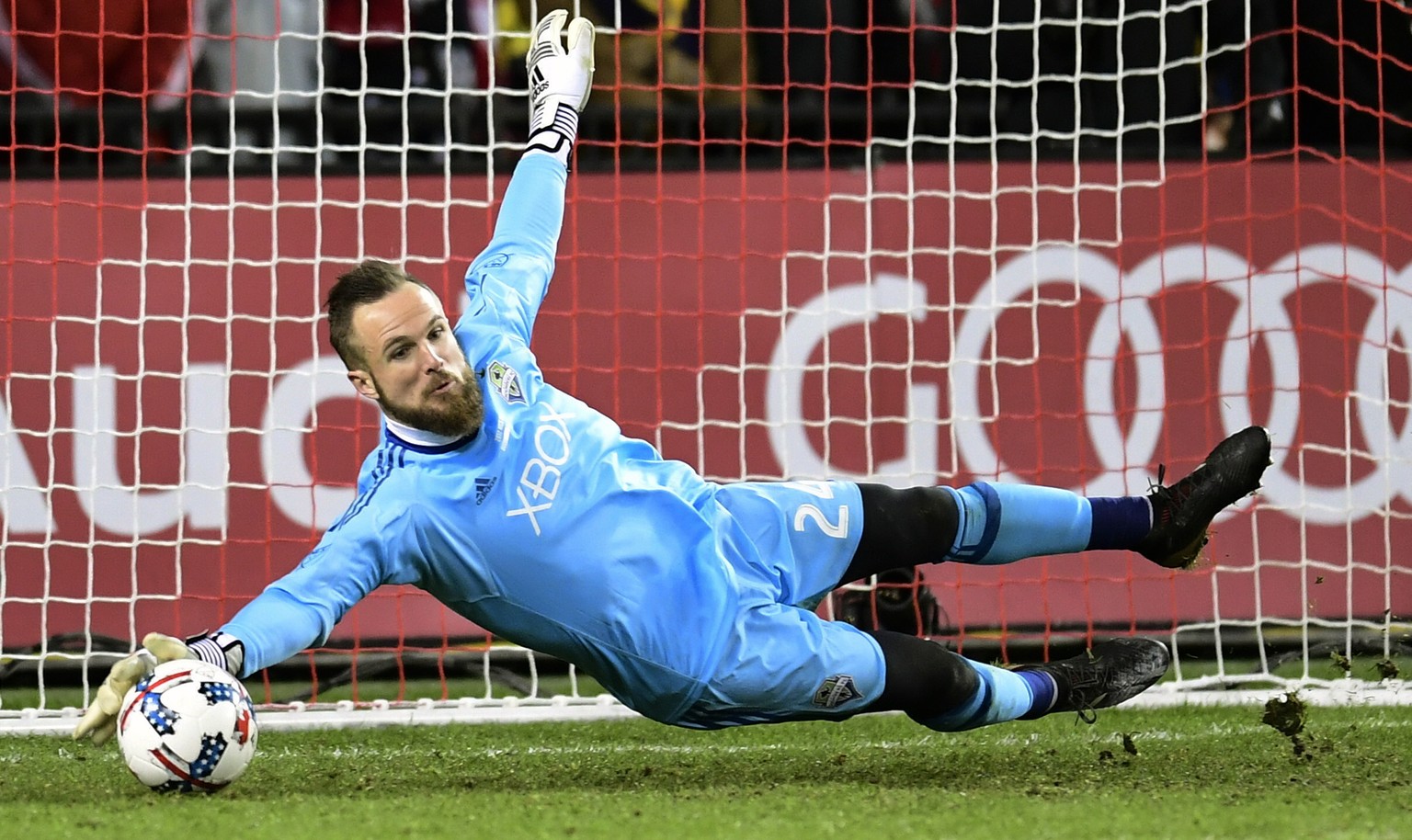 Seattle Sounders goalkeeper Stefan Frei (24) makes a save against Toronto FC during first-half MLS Cup final soccer action in Toronto, Saturday, Dec. 9, 2017. (Frank Gunn/The Canadian Press via AP)