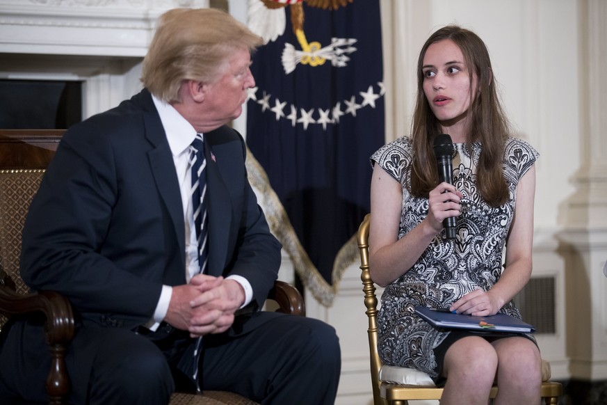 epa06551664 US President Donald J. Trump listens to Marjory Stoneman Douglas High School student Carson Abt during a listening session with high school students and teachers in the State Dining Room o ...