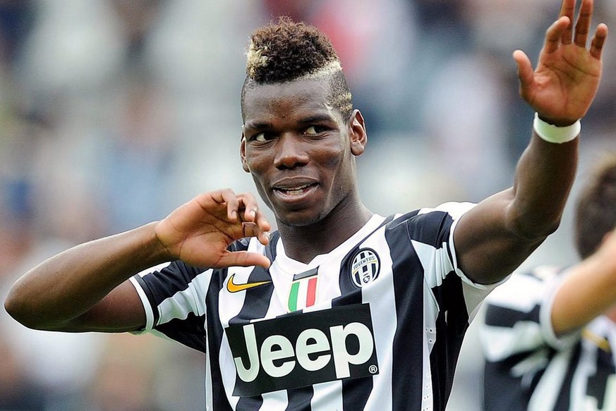 epa03888643 French midfielder of Juventus, Paul Pogba celebrates the victory after the Italian Serie A soccer match between Torino FC and Juventus FC at Olimpico stadium in Turin, Italy, 29 September  ...