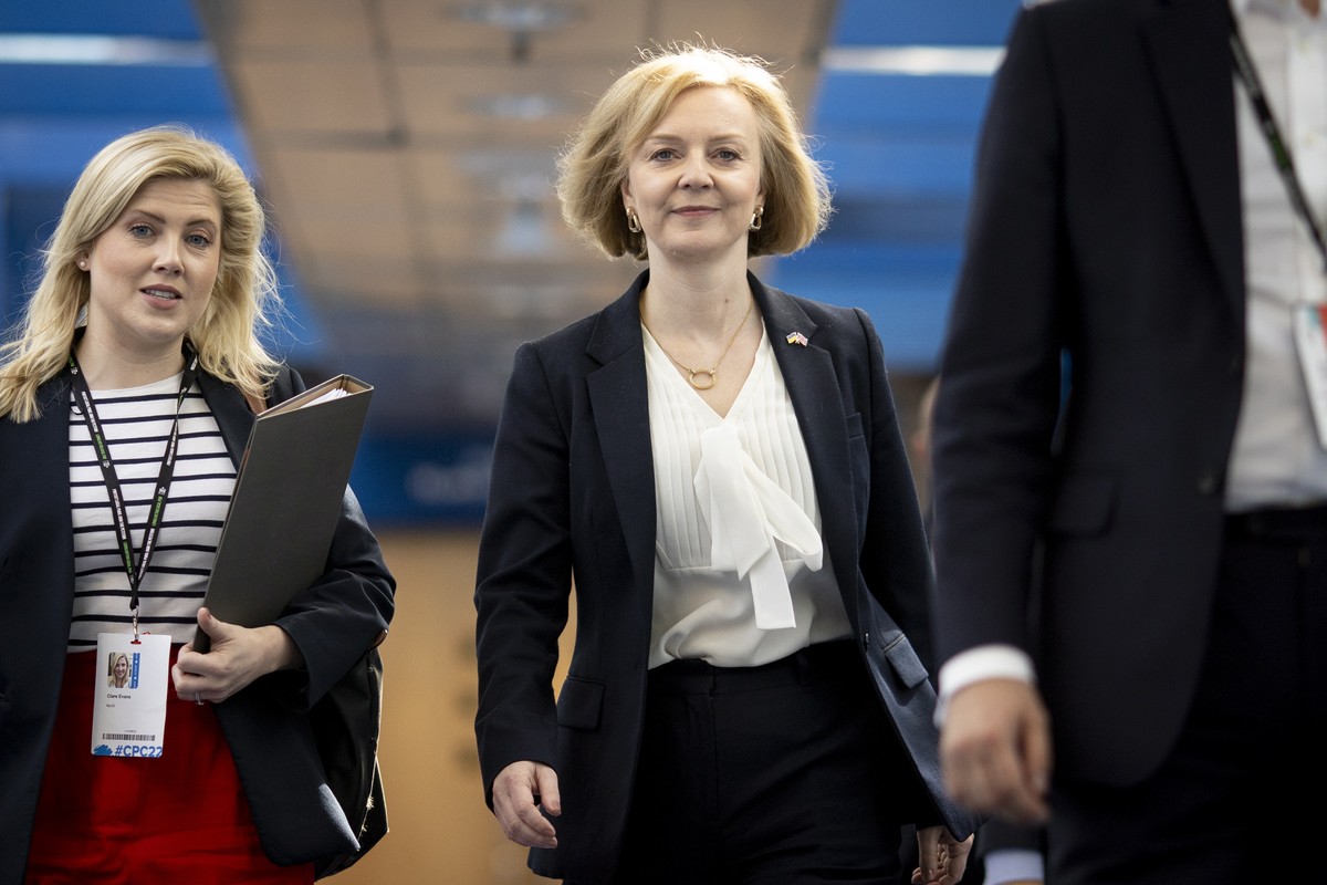 epa10221150 British Prime Minister Liz Truss (R) arrives for the Conservative Party Conference in Birmingham, Britain, 03 October 2022. The government announced a U-turn on scrapping the 45p tax rate, ...