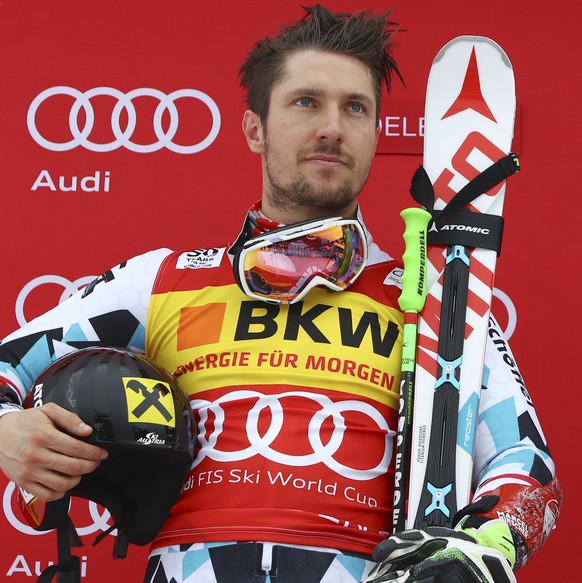 Austria&#039;s Marcel Hirscher, left, second placed, and France&#039;s Alexis Pinturault, the winner, celebrate on podium after an alpine ski, men&#039;s World Cup giant slalom in Adelboden, Switzerla ...