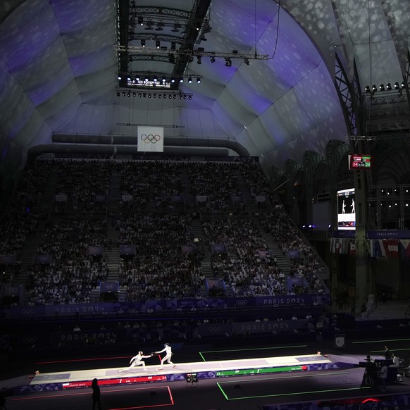 Poland&#039;s Renata Knapic Miazga, left, competes with China&#039;s Sun Yiwen in the women&#039;s team Epee bronze final match against China&#039;s Yu Sihan at the 2024 Summer Olympics, Tuesday, July ...