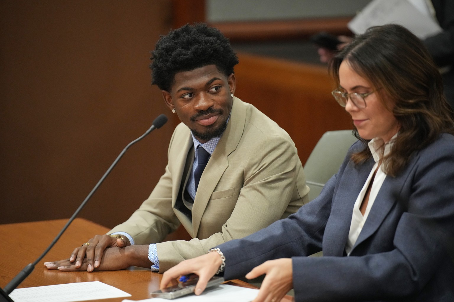 FILE - Lil Nas X, whose legal name is Montero Lamar Hill, appears in court charged with four felony counts, including three counts of battery with injury on a police officer in Los Angeles on March 12 ...