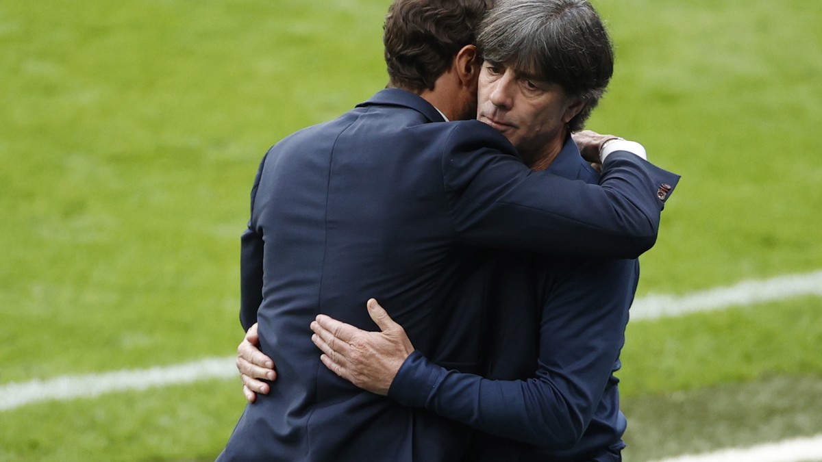 epa09311712 England manager Gareth Southgate (L) greets Germany's head coach Joachim Loew after the UEFA EURO 2020 round of 16 soccer match between England and Germany in London, Britain, 29 June ...