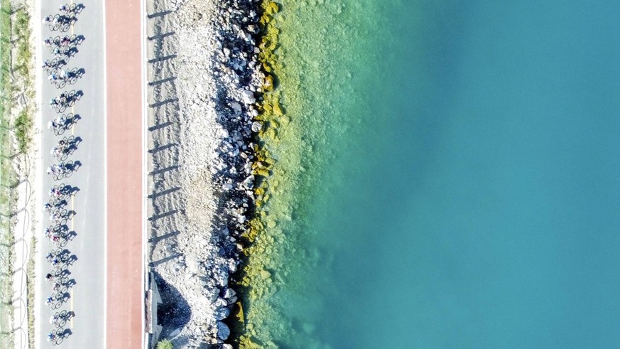 230110 -- BEIJING, Jan. 10, 2023 -- This aerial photo taken on July 26, 2022 shows participants comepeting during the Tour of Sayram Lake cycling in Bortala Mongolian Autonomous Prefecture, northwest  ...