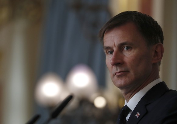 FILE - Britain&#039;s Foreign Secretary Jeremy Hunt, listens to a question during a press conference with the Bishop of Truro Philip Mounstephen about the Bishop&#039;s final report into the Foreign O ...