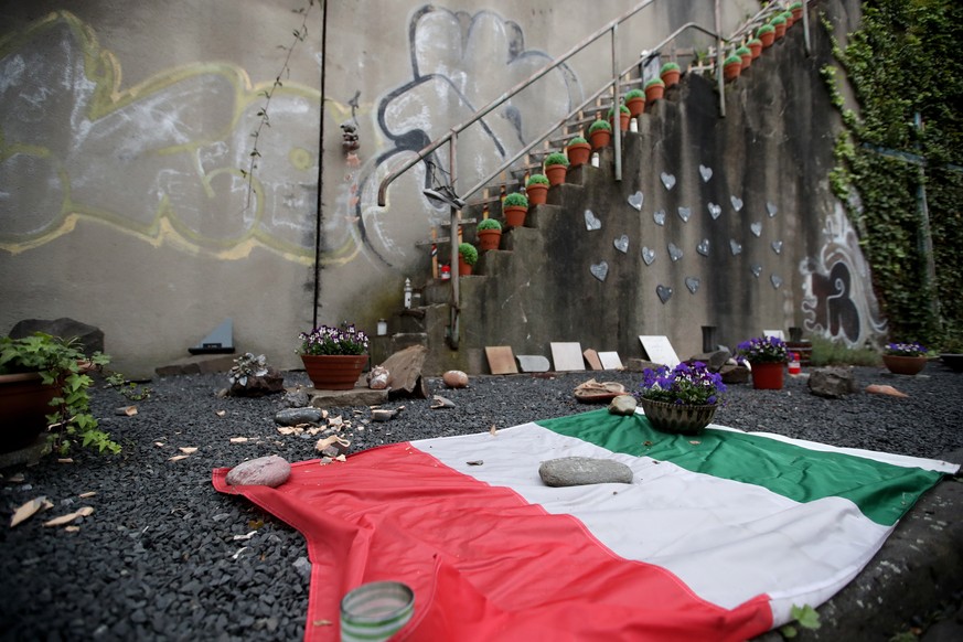 epa08400643 An Italian flag seen at the memorial to victims of the Love Parade disaster in Duisburg, Germany, 04 May 2020. The Duisburg Regional Court has discontinued the trial about the accident at  ...