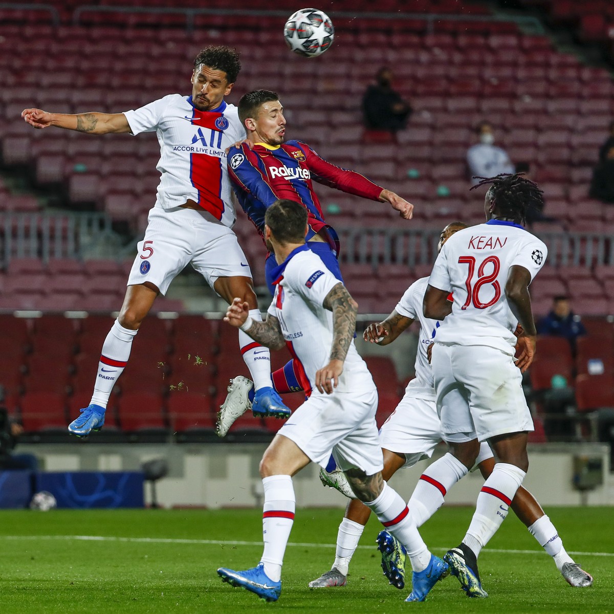 Barcelona's Clement Lenglet, center right, heads for the ball with PSG's Marquinhos during the Champions League round of 16, first leg soccer match between FC Barcelona and Paris Saint-Germa ...