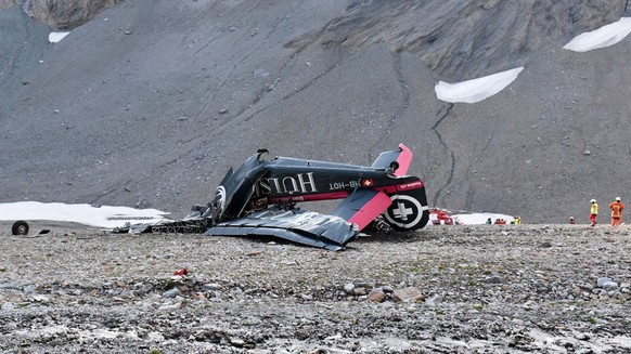 epa06928845 A handout photo made available by Cantonal Police of Grisons shows a wreckege of Junkers JU-52 aircraft after crashing on Piz Segnas above Flims, Switzerland,05 August 2018. According to r ...