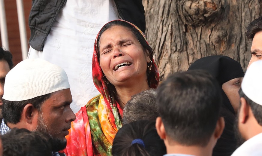 epa08054362 The relative of a victim of the New Delhi building fire reacts outside the emergency ward of Lok Nayak Hospital, in New Delhi, India, 08 December 2019. According to news reports, at least  ...