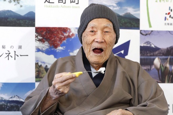 In this April 10, 2018, file photo, Masazo Nonaka eats a cake after receiving the certificate from Guinness World Records as the world&#039;s oldest living man at then age 112 years and 259 days durin ...