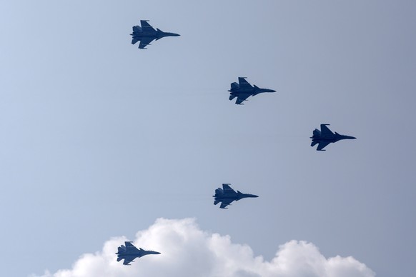 epa12347669 Chinese J-16D, J-20 and J-35A fighter jets fly in formation during a military parade marking the 80th anniversary of the end of the Sino-Japanese War in Beijing, China, 03 September 2025.  ...