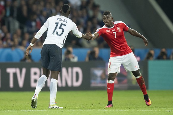 FranceÕs midfielder Paul Pogba, left, reacts next to Swiss forward Breel Embolo, right, during the UEFA EURO 2016 group A preliminary round soccer match between Switzerland and France, at the Pierre M ...