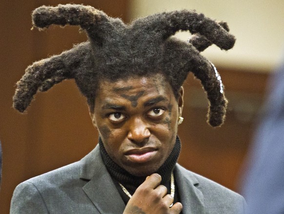 FILE - Rapper Kodak Black appears in court at the Florence County, South Carolina, courthouse in Florence, S.C., April 28, 2021. Los Angeles Police say four people were shot and wounded after a fight  ...