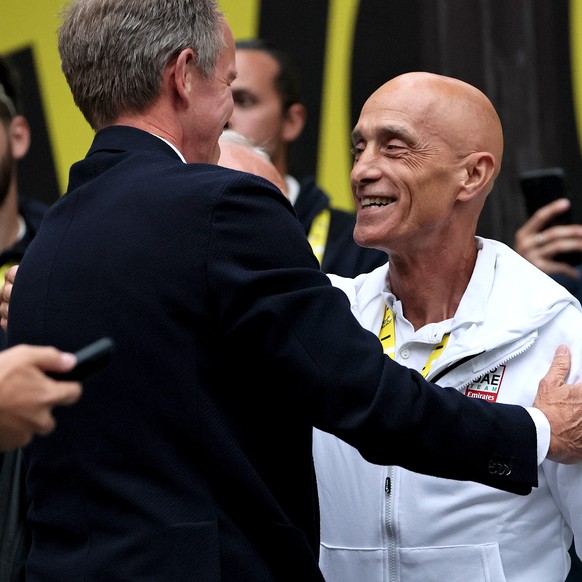 epa12266734 Mauro Gianetti (R), Team Principal and CEO of UAE Team Emirates, celebrates after the last stage of the Tour de France over 132.3km from Mantes-la-Ville to Paris, France, 27 July 2025. Slo ...
