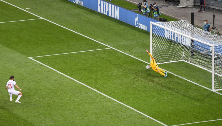 France&#039;s goalkeeper Hugo Lloris saves a penalty taken by Switzerland&#039;s Ricardo Rodriguez, left, during the Euro 2020 soccer championship round of 16 match between France and Switzerland at N ...