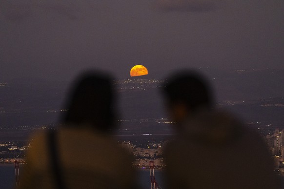 A super moon raises near the border between Israel and Lebanon as seen from Haifa bay, northern Israel, Saturday, Nov. 16, 2024. (AP Photo/Francisco Seco)