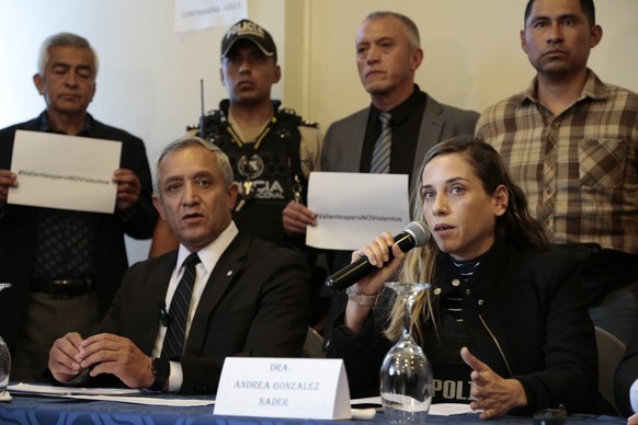 epa10794029 Environmentalist and politician Andrea Gonzalez Nader (R) speaks as General Patricio Carrillo (L) listens during a press conference along with other supporters of assassinated presidential ...