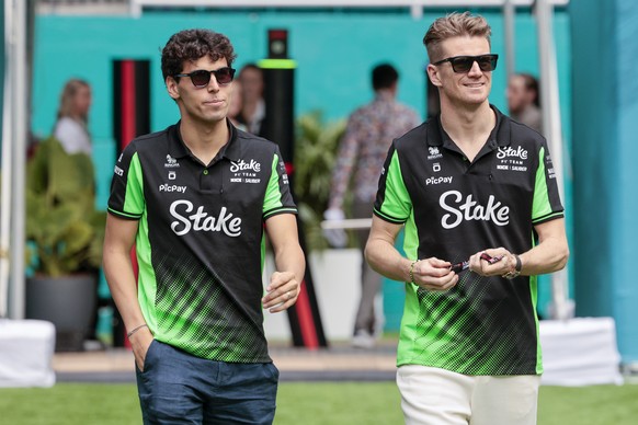 epa12069569 Kick Sauber drivers Nico Hulkenberg (R) of Germany and Gabriel Bortoleto of Brazil pictured in the paddock prior to the practice session for the Formula 1 Miami Grand Prix, in Miami Garden ...