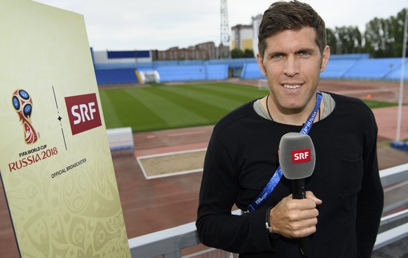 Former Swiss soccer player and SRF TV consultant Benjamin Huggel poses after a training session of the Switzerland&#039;s national soccer team at the Torpedo Stadium, in Togliatti, Russia, Wednesday,  ...