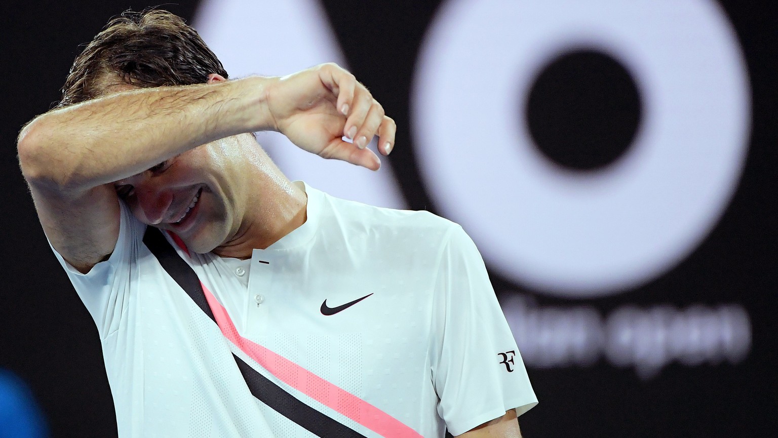 epa06456805 Roger Federer of Switzerland reacts after winning his third round match against Richard Gasquet of France at the Australian Open Grand Slam tennis tournament in Melbourne, Australia, 20 Ja ...