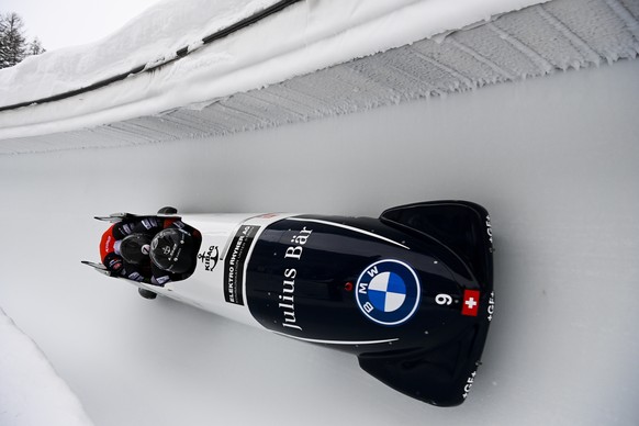 Michael Vogt of Switzerland and his team races during the men&#039;s 4-bob World Cup in St. Moritz, Switzerland, on Sunday, January 17, 2021. (Gian Ehrenzeller/Keystone via AP)