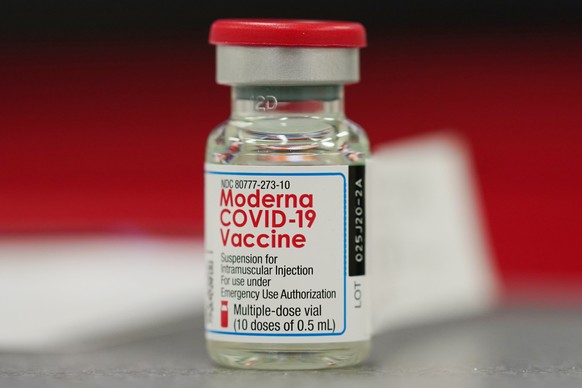 FILE - This Wednesday, Dec. 23, 2020 file photo shows a vial of the Moderna COVID-19 vaccine in the first round of staff vaccinations at a hospital in Denver. U.S. health advisers are debating if mill ...