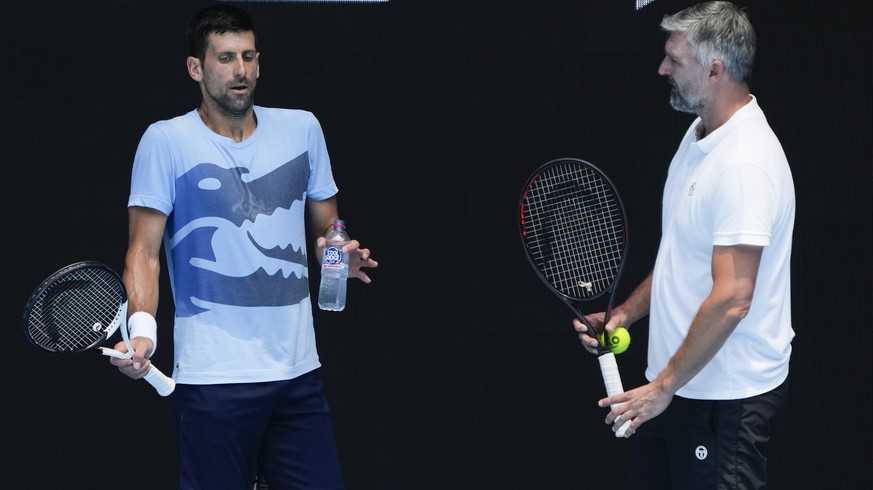 FILE - Serbia&#039;s Novak Djokovic, left, gestures as talks with coach Goran Ivanisevic during a practice session ahead of the Australian Open tennis championship in Melbourne, Australia, Friday, Jan ...