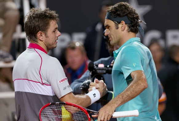 Roger Federer, of Switzerland, right, salutes his compatriot Stan Wawrinka after beating hims in a semifinal match at the Italian Open tennis tournament, in Rome, Saturday, May 16, 2015. Federer beat  ...