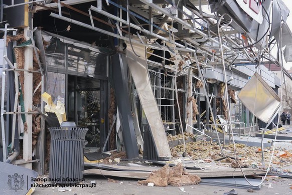 epa12591721 ?A handout photo made available by the Zaporizhzhia Regional State Administration shows the damage after a Russian drone strike on a grocery store in Zaporizhzhia, Ukraine, 14 December 202 ...