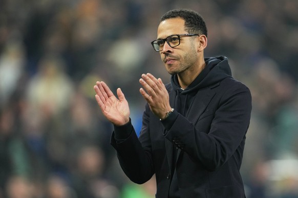 FILE - Chelsea's head coach Liam Rosenior applauds supporters after the English Premier League soccer match between Everton and Chelsea in Liverpool, England, Saturday, March 21, 2026. (AP Photo/ ...