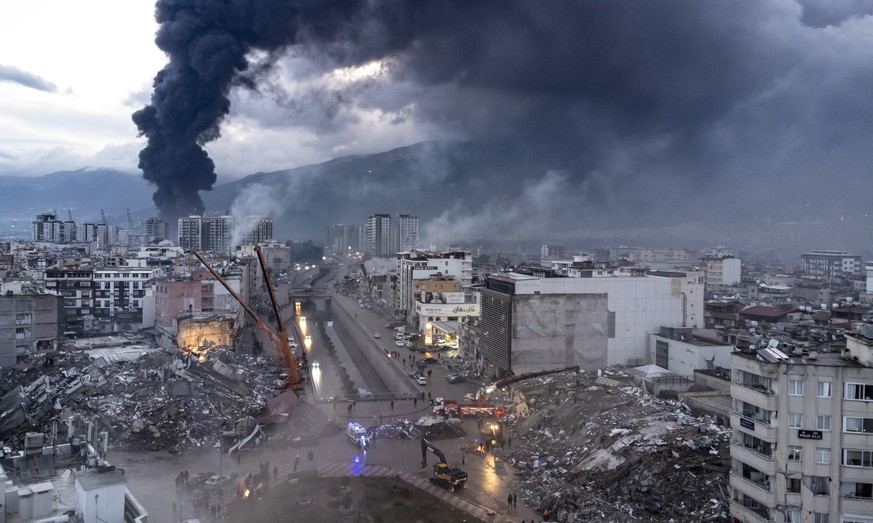 epa10452058 An aerial image taken by a drone shows rescuers during a search and rescue operation at the site of a collapsed building after an earthquake in Iskenderun, Hatay district, Tu...