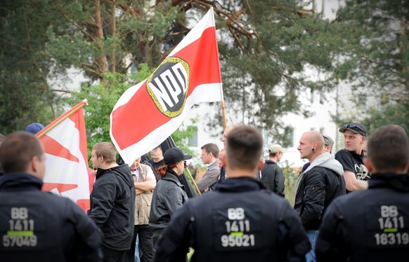 epa05721082 (FILE) - Flags wave during a rally of far-right wing party NPD at a home for asylum seekers in Eisenhuettenstadt, Germany, 01 May 2014 (reissued 16 January 2017). The German Federal Consti ...